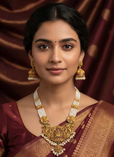 Jewel City Antique Gold-Plated Temple Lakshmi Haram Necklace Set with White Beads & Jhumka Earrings