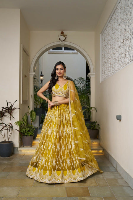 Eilara Glamorous Mustard Yellow Butterfly Net With Tone To Tone Thread And Sequence Embroidered Work Lehenga Choli For Wedding