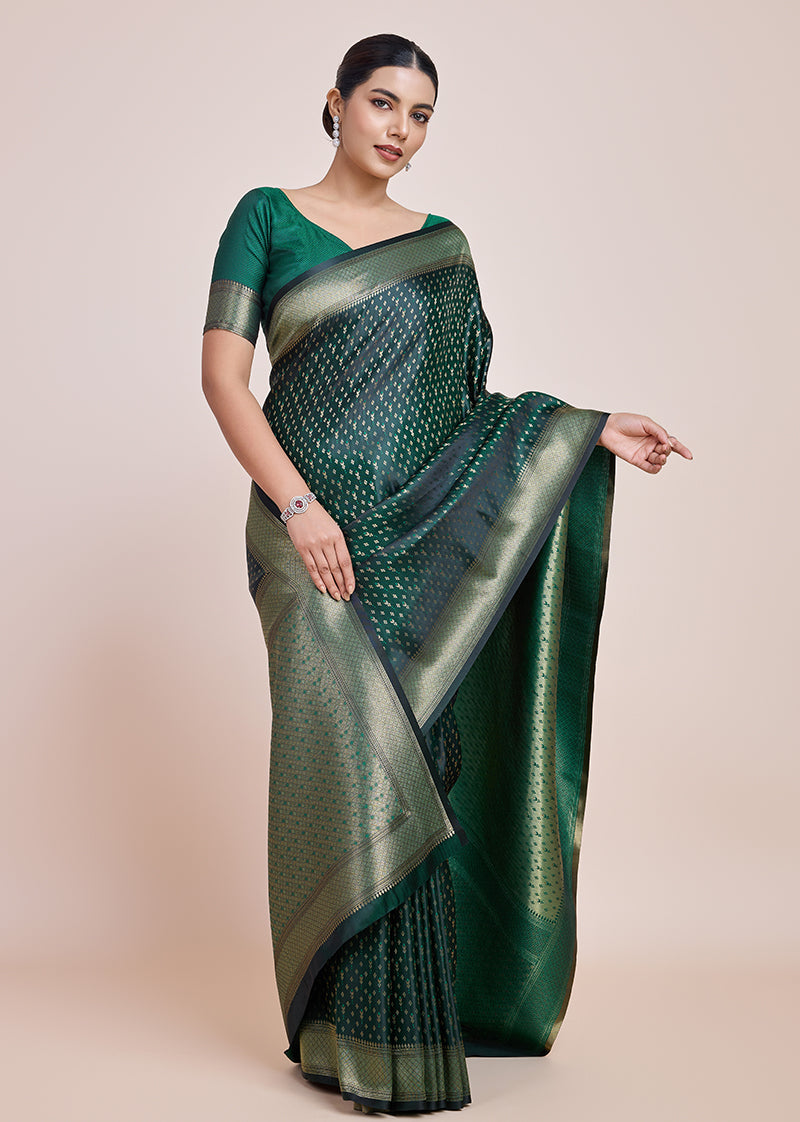 Monjolika Fashion Glamour And Tradition With This Zari Woven Dark Green Color Banarasi Satin Silk Saree