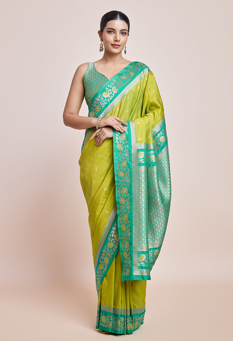 Monjolika Fashion Parrot Green Banarasi Silk In Satin Is Classy Embellished With Golden Zari Work Saree