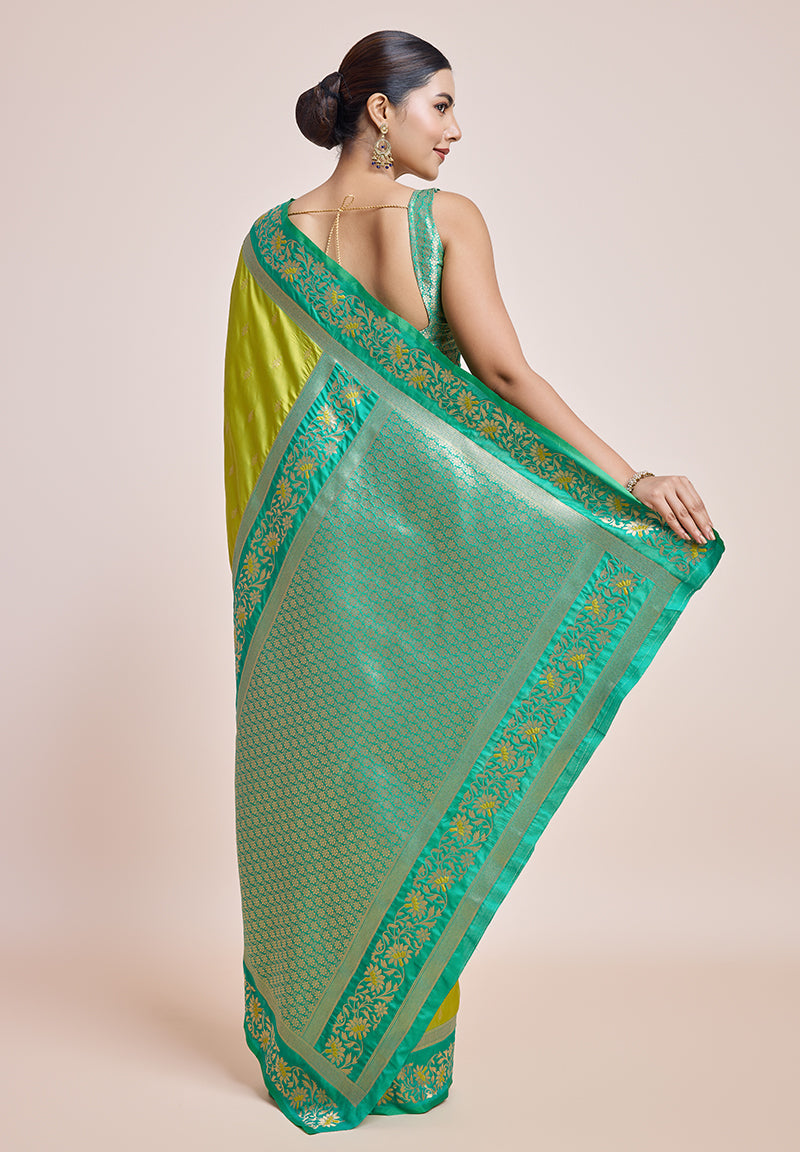 Monjolika Fashion Parrot Green Banarasi Silk In Satin Is Classy Embellished With Golden Zari Work Saree