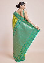 Monjolika Fashion Parrot Green Banarasi Silk In Satin Is Classy Embellished With Golden Zari Work Saree