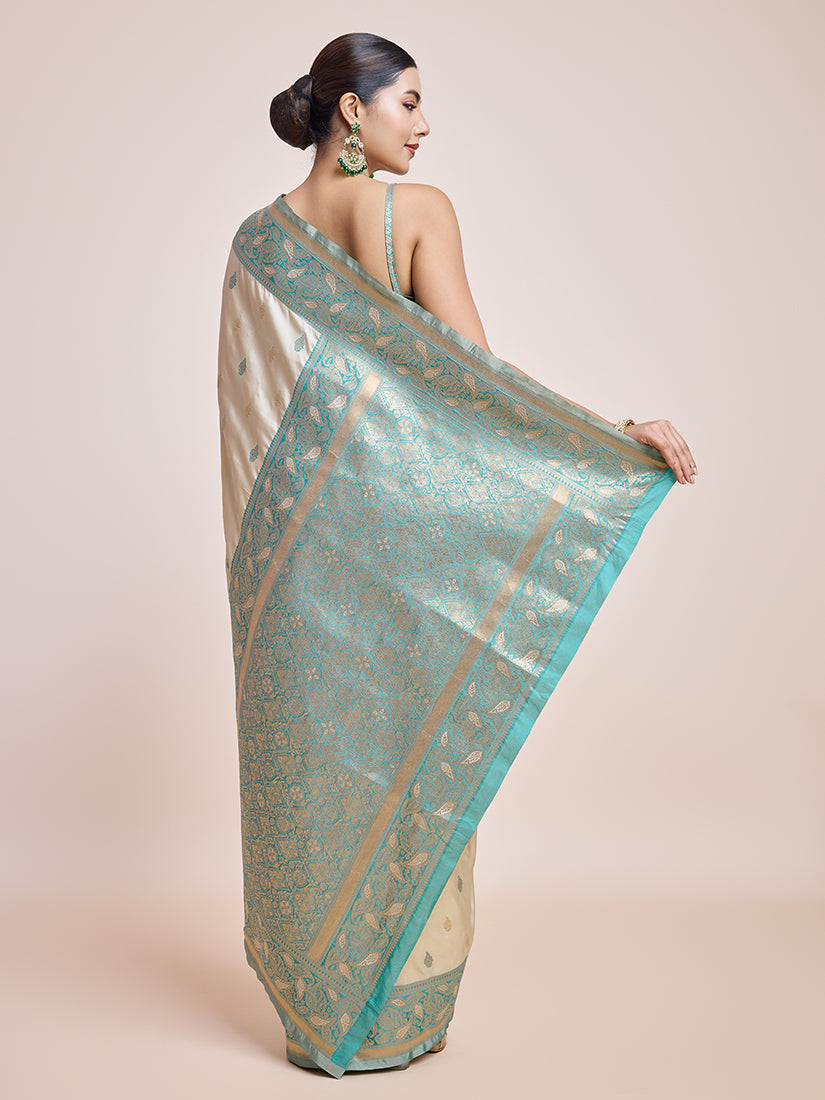 Monjolika Fashion Exquisite Designs With This Cream Banarasi Satin Silk Saree