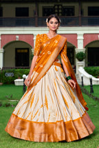Lorenvalley Cream and Mustard Dola Silk Shibori Print With Zari Weaving Border Lehenga Choli