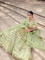 Myra Pista Green Soft Net Heavy Embroidered Lehenga