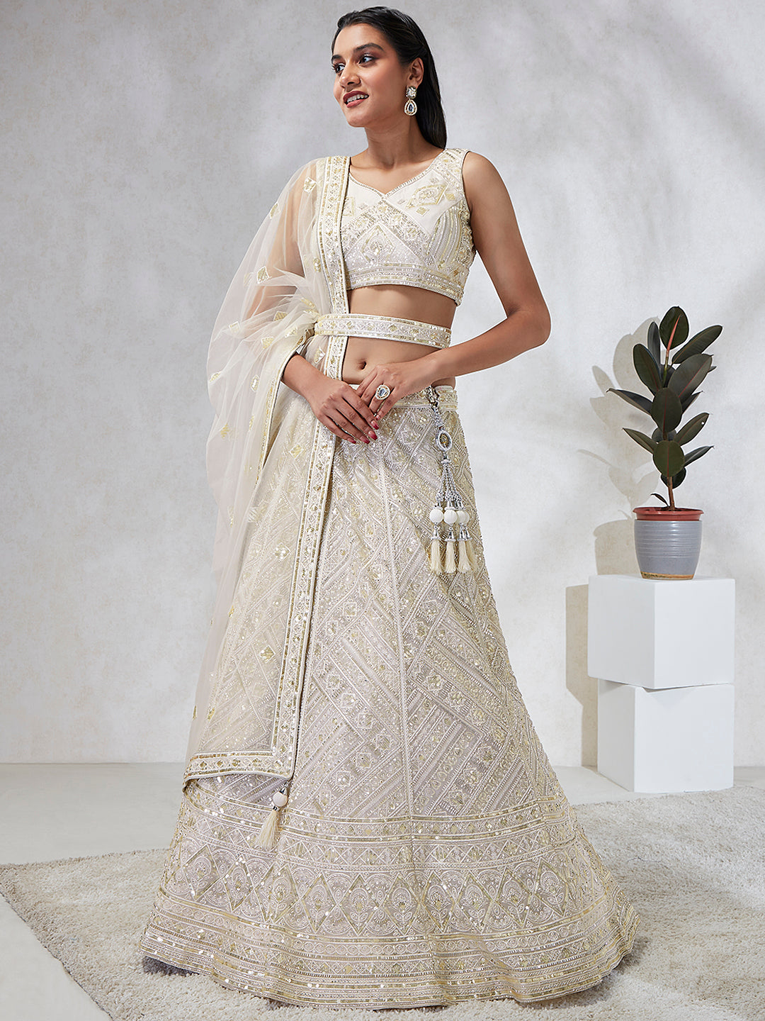 House of Panchhi Cream Net Cutdana, Sequins And Zarkan Embroidery Lehenga Choli & Dupatta
