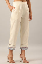 Juniper Women's Off-White Solid Cotton Flex Pants With Printed Hem, Pintucks & Lace Work