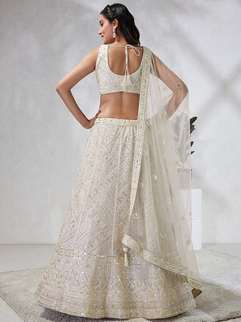 House of Panchhi Cream Net Cutdana, Sequins And Zarkan Embroidery Lehenga Choli & Dupatta