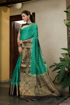 Vardha Teal Green Golden Zari Banarasi Raw Silk Saree