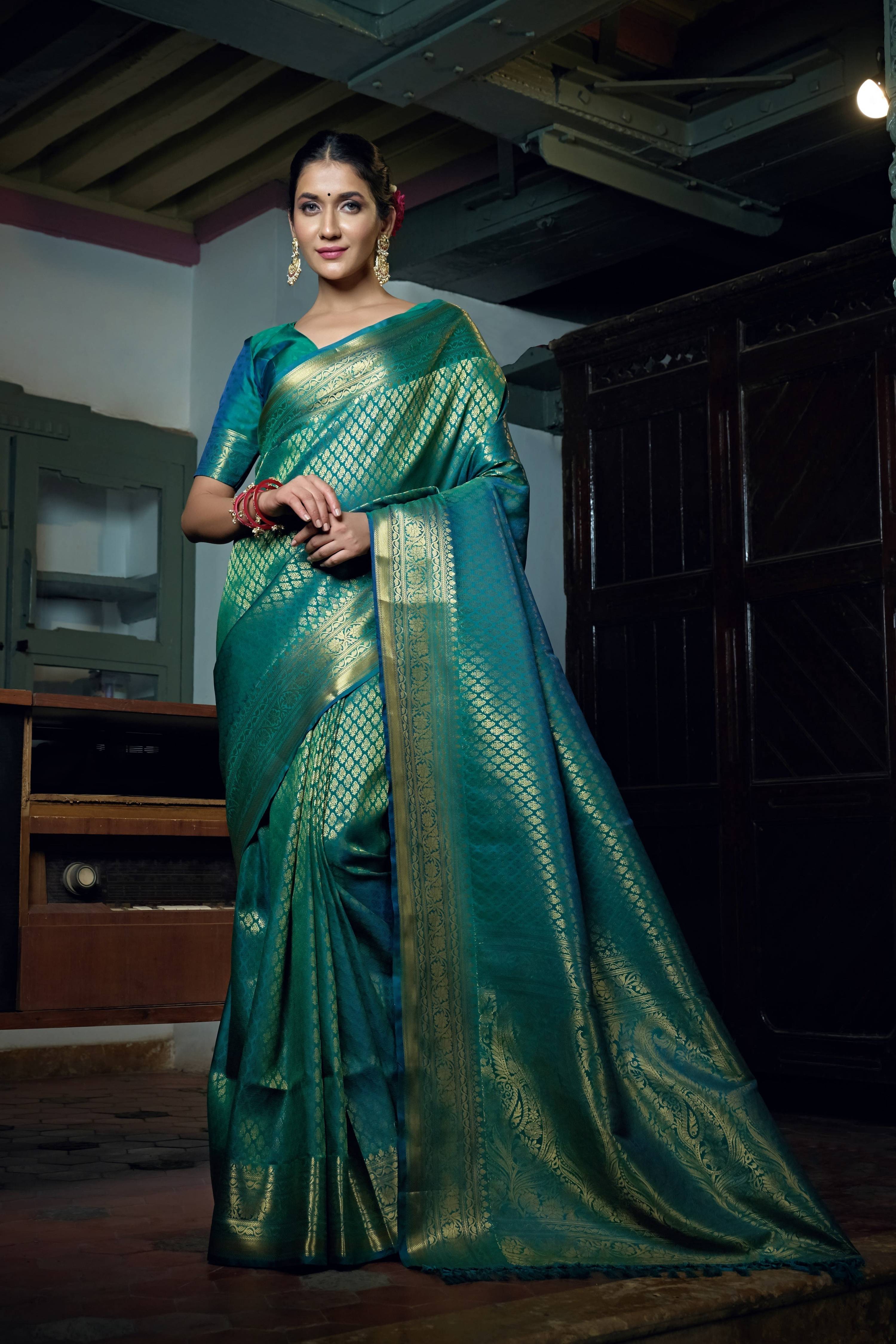 Vardha Teal Blue Golden Zari Kanjeevaram Silk Saree