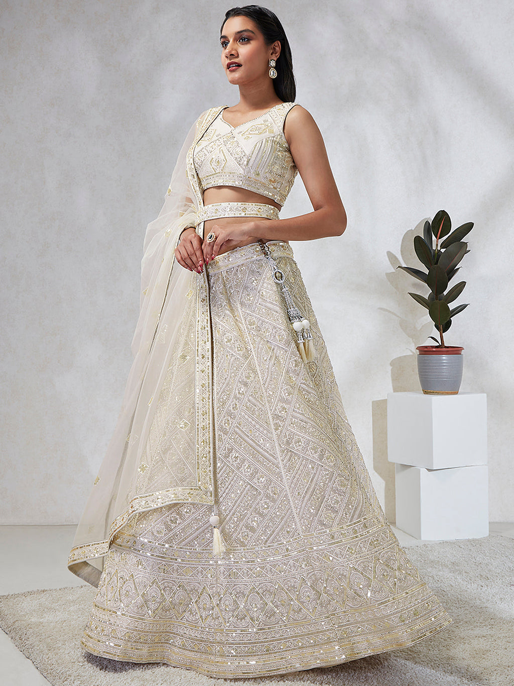 House of Panchhi Cream Net Cutdana, Sequins And Zarkan Embroidery Lehenga Choli & Dupatta