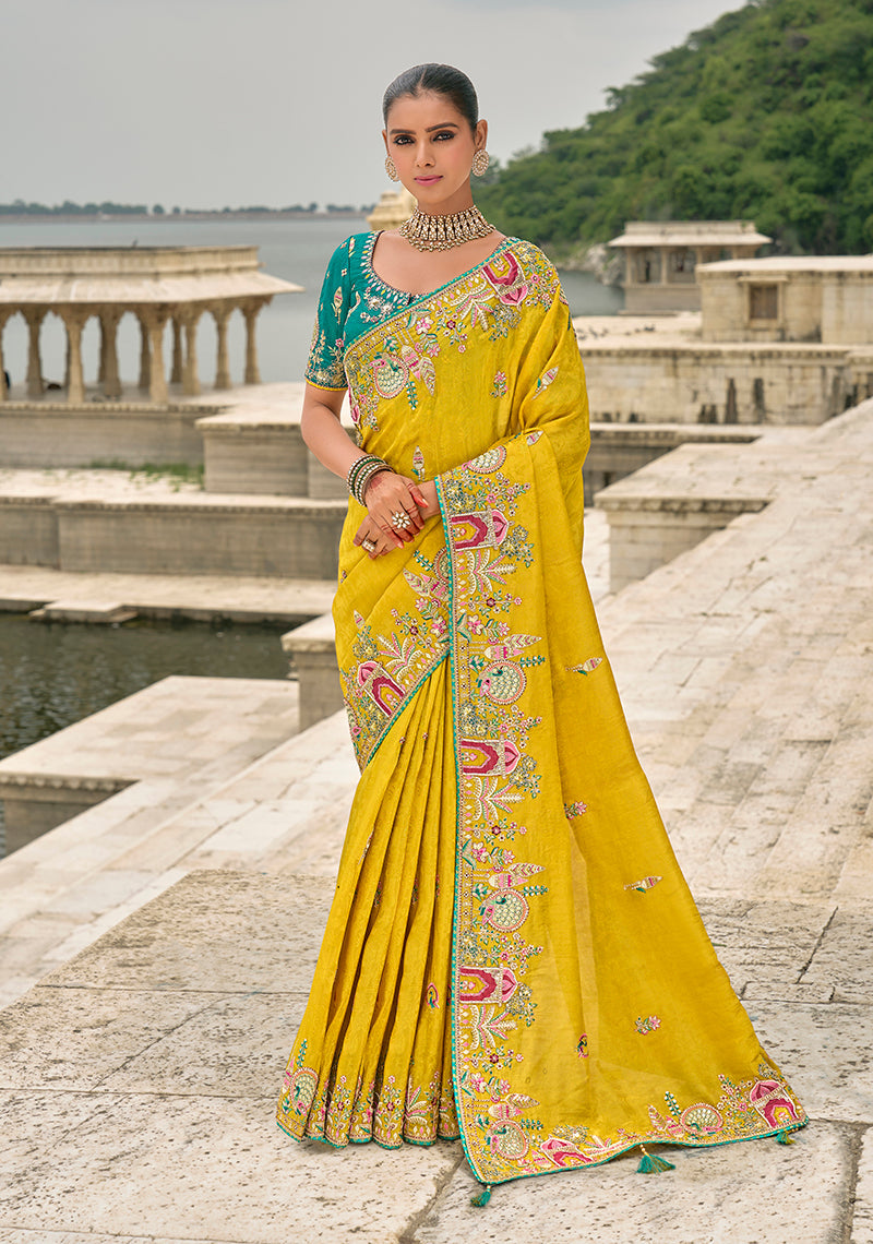Monjolika Fashion Yellow Color Banarasi Silk Blend Embroidered With Heavy Patchwork Border Saree With Contrast Blouse