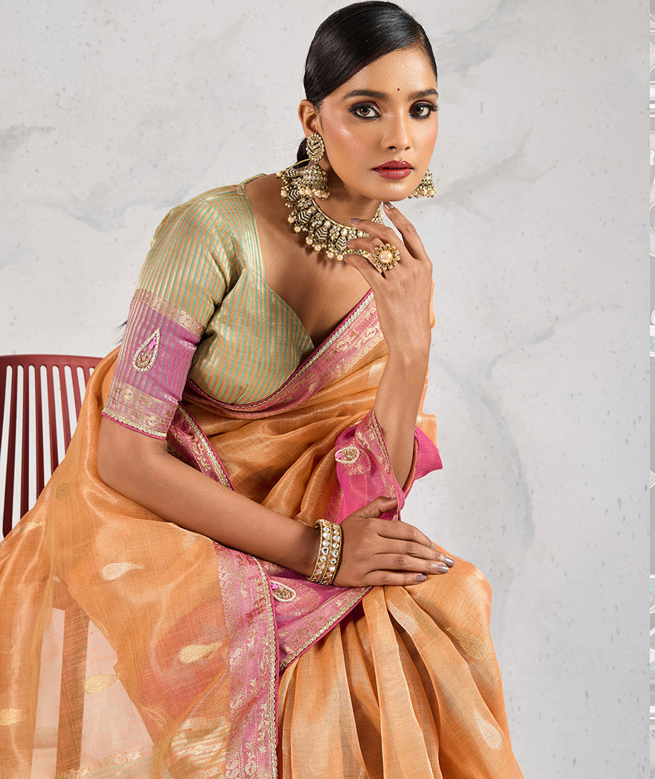 Monjolika Fashion Charming Light Orange Soft Tissue Linen Saree With Pretty Blouse Piece