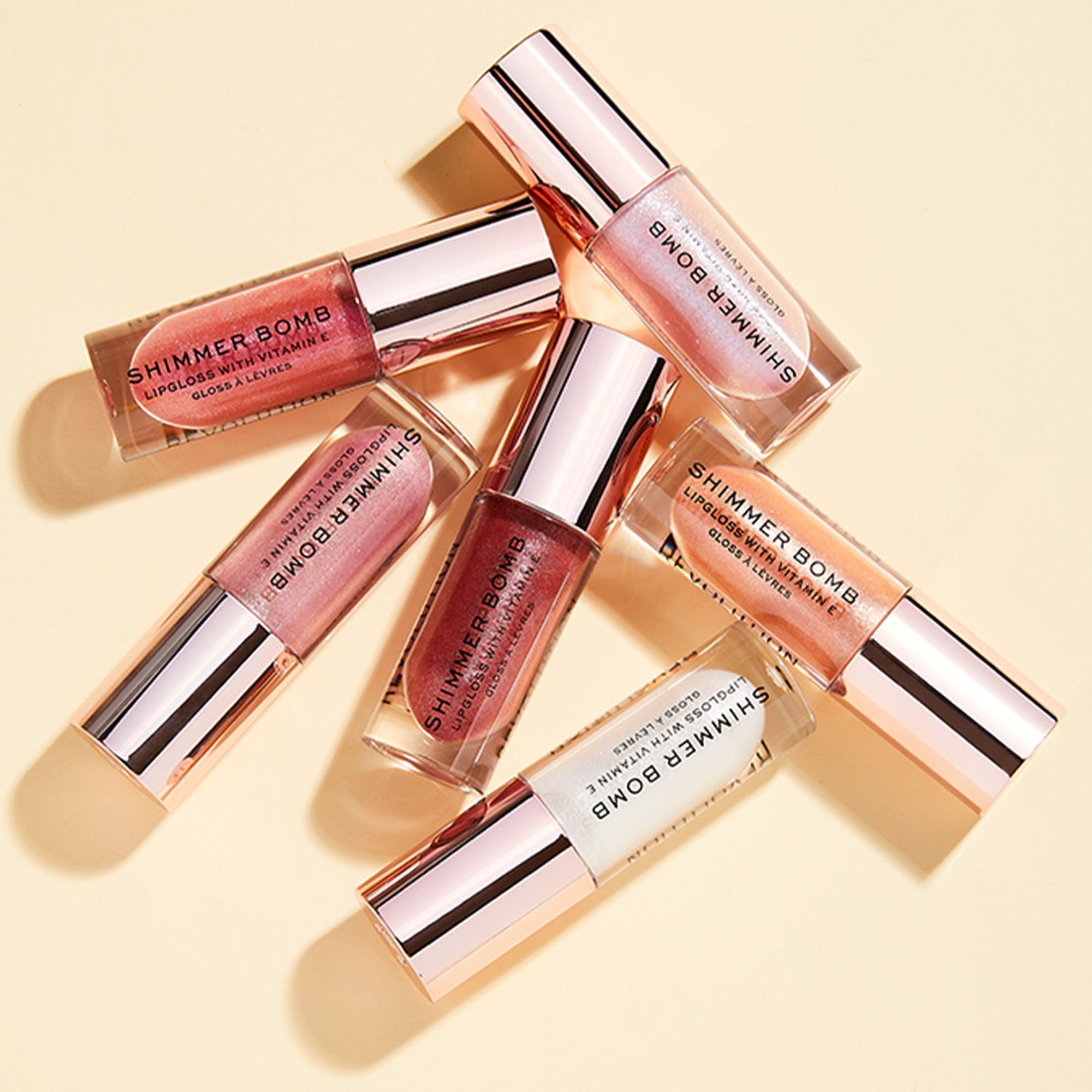 Makeup Revolution Shimmer Bomb Lipgloss-Infused With Vitamin E For Extra Nourishment - Sparkle Pink