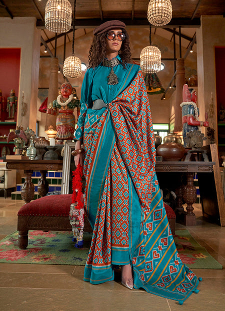 Monjolika Fashion Aqua Blue and Rust Silk Blend Ikat Print Work Contemporary Saree