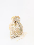 NR By Nidhi Rathi Cream-Coloured & Gold-Toned Embellished Potli Clutch - Distacart