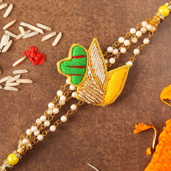 Meenakari Glimming Rakhi & Kaju Rolls Box - Distacart