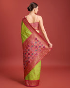 Monjolika Fashion Exquisite Designs With This Regal Parrot Green Patola Pallu Banarasi Tissue Silk Saree