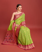 Monjolika Fashion Exquisite Designs With This Regal Parrot Green Patola Pallu Banarasi Tissue Silk Saree