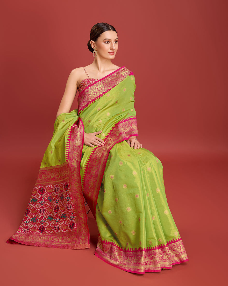 Monjolika Fashion Exquisite Designs With This Regal Parrot Green Patola Pallu Banarasi Tissue Silk Saree