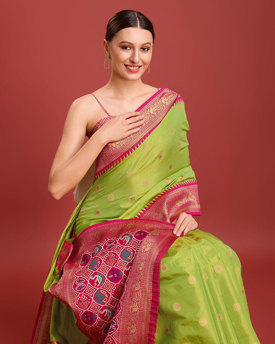 Monjolika Fashion Exquisite Designs With This Regal Parrot Green Patola Pallu Banarasi Tissue Silk Saree