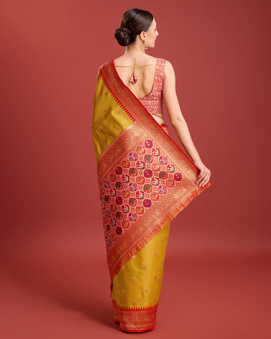 Monjolika Fashion Exquisite Designs With This Regal Mustard Color Patola Pallu Banarasi Tissue Silk Saree