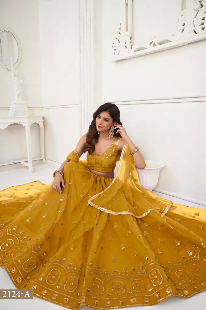 Aastha Fashion Mustard Yellow Butterfly Net Tone To Tone Thread Work And Sandwich Sequence Work Embroidery Wedding Wear Lehenga Choli