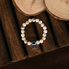 NVR Women & Men Cream-colored Evil Eye Elasticated Rakhi With Roli Chawal - Distacart