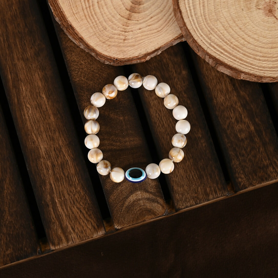 NVR Women & Men Cream-colored Evil Eye Elasticated Rakhi With Roli Chawal - Distacart