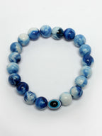 NVR Women & Men Set of 4 Multicolor Evil Eye Elasticated Rakhi With Roli Chawal - Distacart