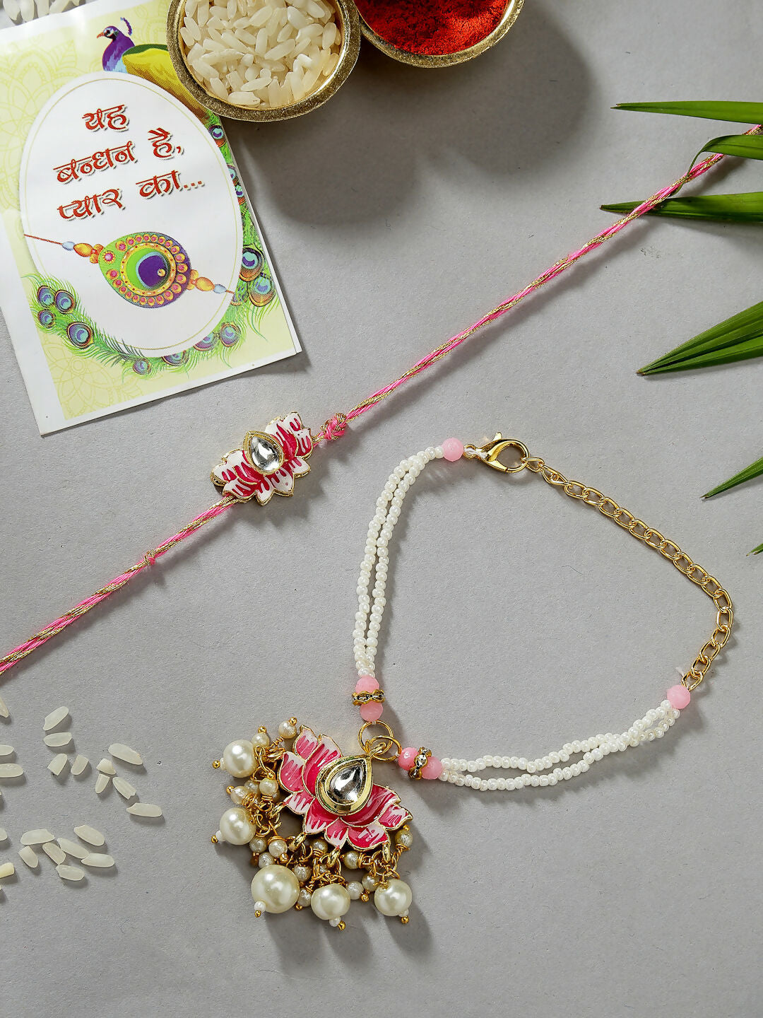 NVR Women & Men Set of 2 Pink Lotus Shape Kundan-Studded & Beaded Wraparound Rakhi Set With Roli Chawal & Chocolate - Distacart