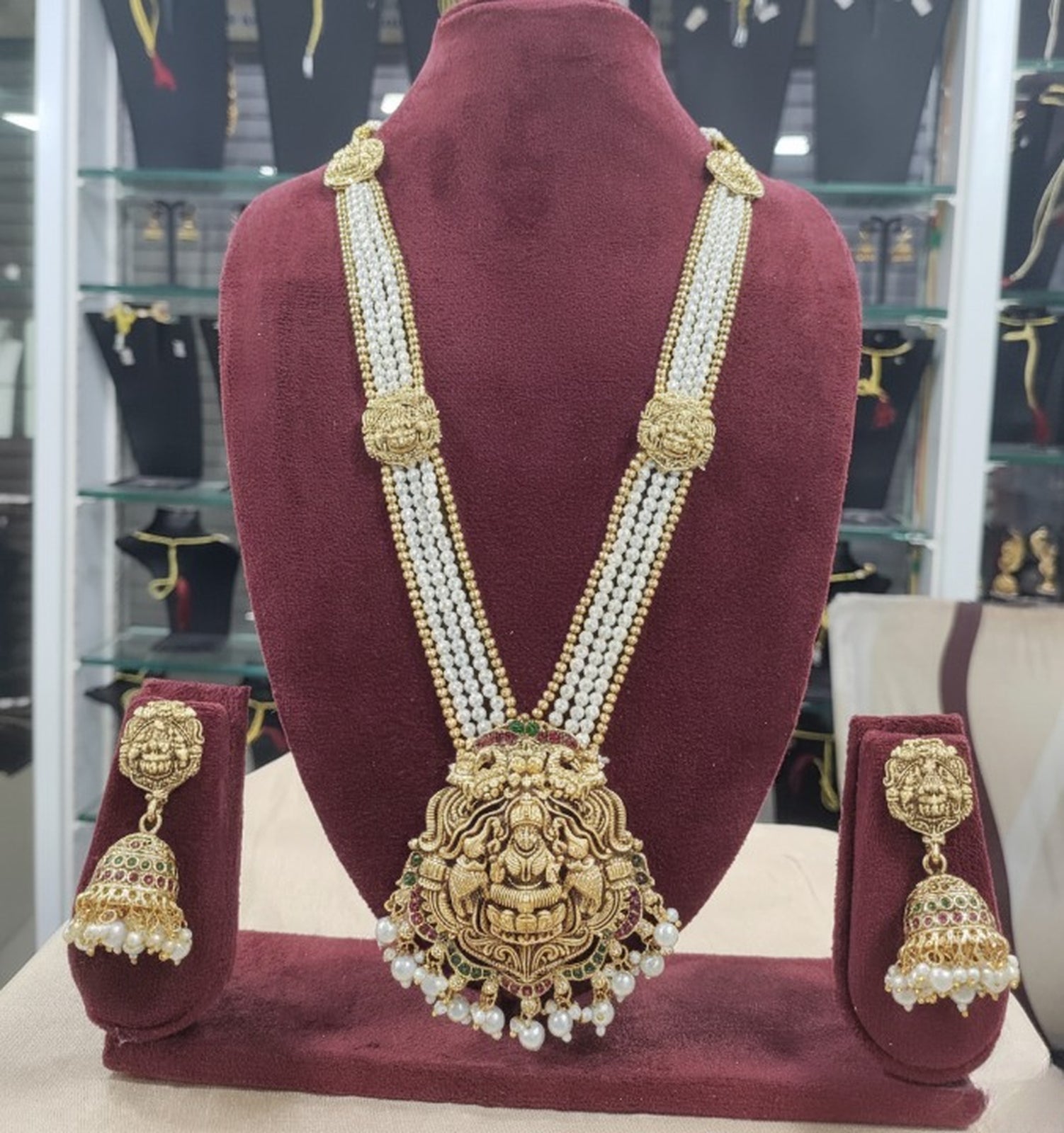Jewel City Antique Gold-Plated Lakshmi Long Haram Set with White Beads & Jhumkas – Traditional Temple Jewelry