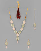 VOJ Gold-Polished Nude Pink And Mint Green Stone Studded Jewellery Set With Maang Tikka