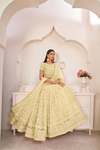 Aastha Fashion Lemon Yellow Butterfly Net White Cotton Thread Work, Zari Work And Sandwich Sequence Work Embroidery Wedding Wear Lehenga Choli