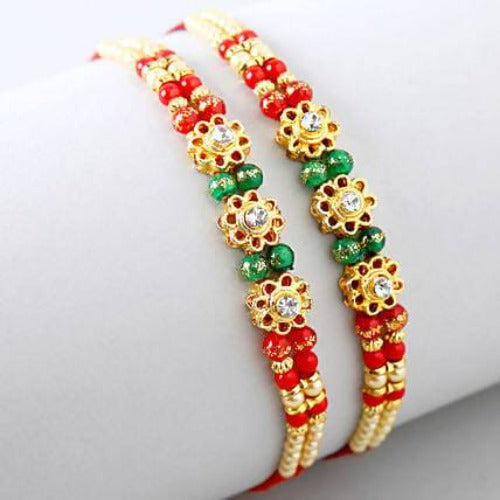 Set of 2 Charming Beads Rakhi and Dairy Milk Fruit N Nut Chocolates