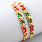 Set of 2 Charming Beads Rakhi and Dairy Milk Fruit N Nut Chocolates