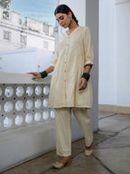 Janasya A-Line Dobby Cotton Cream Self Design V-Neck Tunic & Bottom