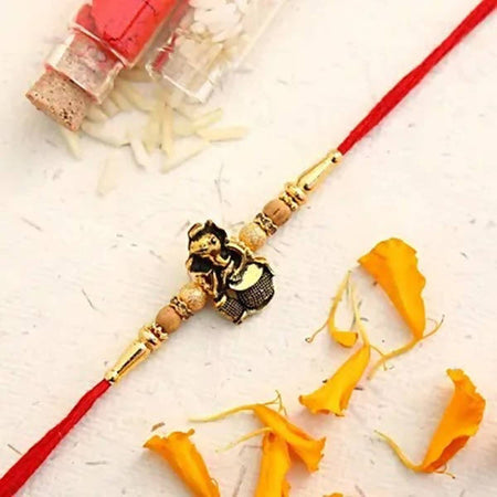 Devotional Lord Ganesha Rakhi & Kaju Roll Box