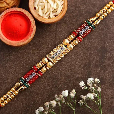 Dainty Kundan Rakhi And Dairy Milk Silk Chocolates