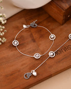 Jewels Nest Orbit Glow Silver Anklet With Circular Disc Accents And Heart Toggle Closure
