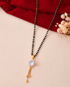 Jewels Nest Classic Gold-Tone White Stone Mangalsutra With Single Drop Tassel Pendant - Distacart