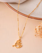 Jewels Nest Gold-Tone Flute Om Pendant Necklace For Women