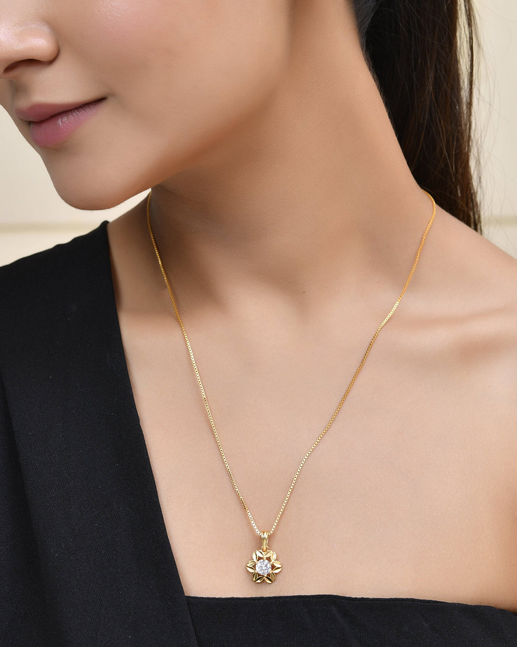 Jewels Nest Elegant Gold-Polished Floral Pendant with Sparkling Stone
