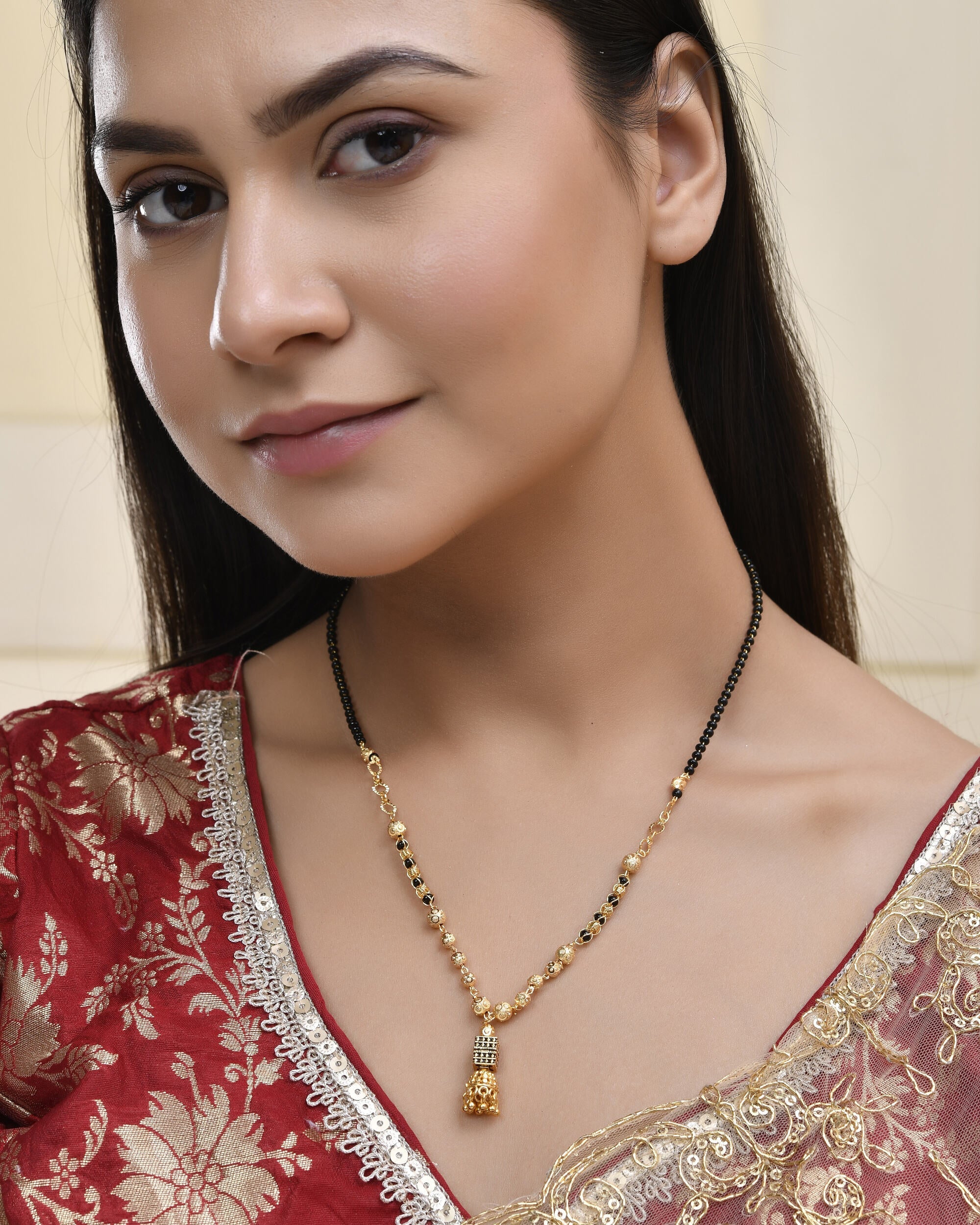 Jewels Nest Graceful Gold-Polished Black Bead Mangal Sutra with Intricate Pendant - Distacart
