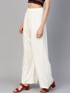 Jompers Women Off-White Solid Straight Palazzos - Distacart