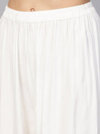 Jompers Women Off-White Solid Straight Palazzos - Distacart