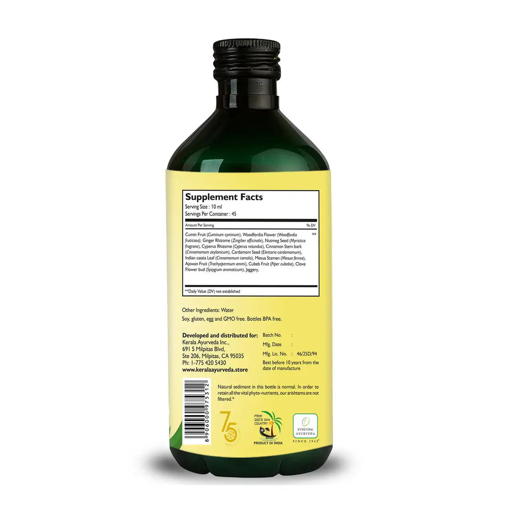 Back view of a bottle of Kerala Ayurveda Jeerakarishtam, an ayurvedic oil of about 15.2 fl oz / 450 ml, with a label about the product ingredients and supplements.