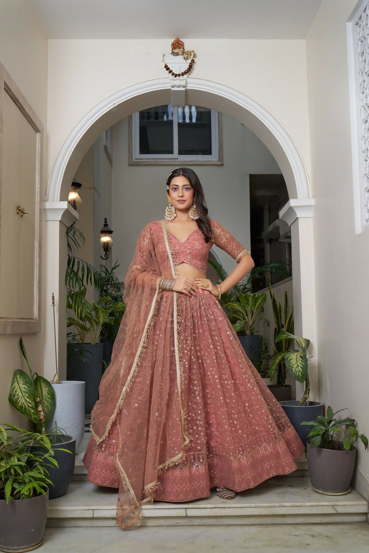 Eilara Glamorous Rust Butterfly Net With Tone To Tone Thread And Sequence Embroidered Work Lehenga Choli For Wedding