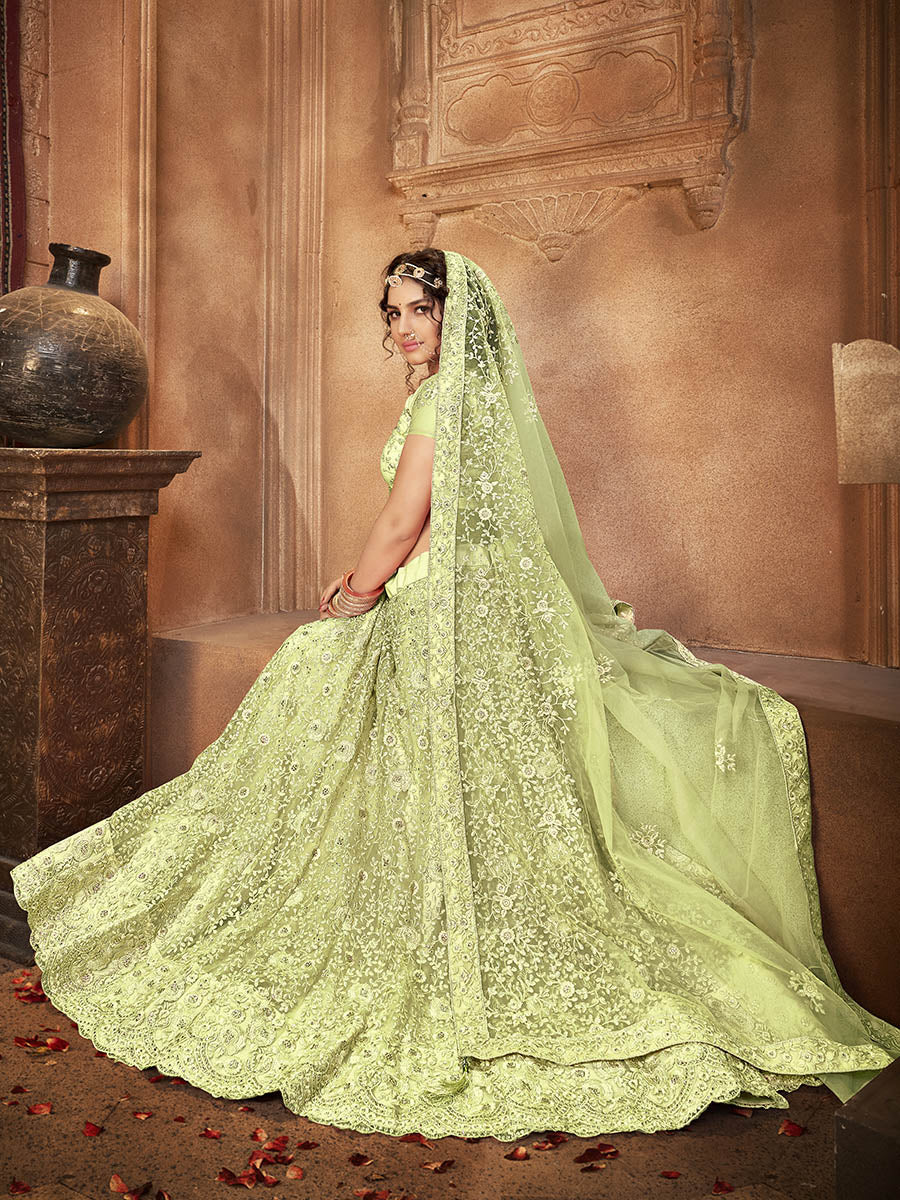Myra Pista Green Heavy Embroidered Net Lehenga