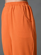 Myshka Women's Solid Ribbed High-Rise Wide Leg Casual Trousers in Orange Color